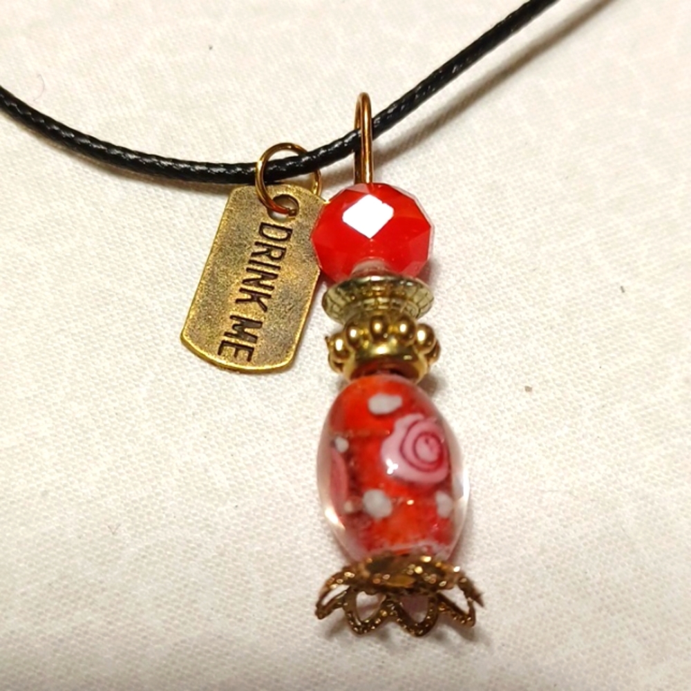 Alice in Wonderland potion bottle pendant beaded gold red flower murano glass